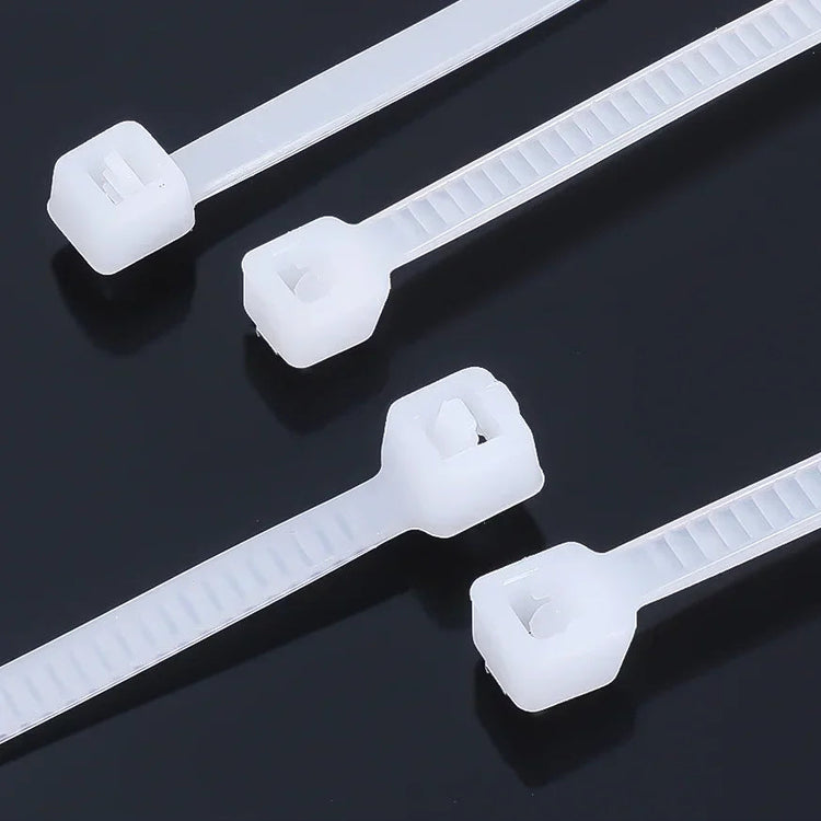 Lot de 100 attaches autobloquantes en nylon, haute résistance jusqu’à 27,2 kg, usage intérieur et extérieur, résistantes aux températures extrêmes, idéales pour organiser câbles, fils, tuyaux, jardin, bricolage, voiture et bureau. Livraison offerte !